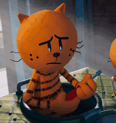 A Stuffed Cat With A Sad Face Is Holding A Red Object GIF