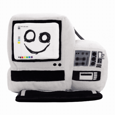 A Stuffed Computer With A Smiling Face Drawn On It GIF