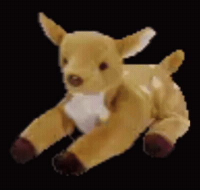 A Stuffed Deer Is Laying Down On A Black Background And Looking At The Camera . GIF