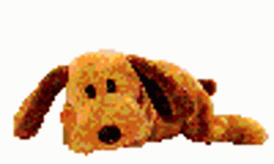 A Stuffed Dog Is Laying Down On A White Surface . GIF