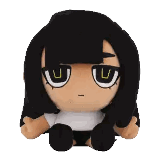A Stuffed Doll With Black Hair And A White Shirt Has A U On Her Eyes Sticker