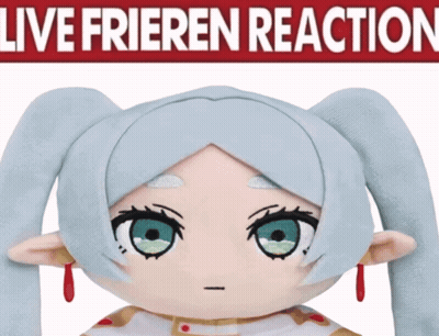 A Stuffed Doll With Blue Hair And Red Earrings Stands In Front Of A Sign That Says Live Frieden Reaction GIF