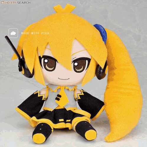 A Stuffed Doll With Headphones And A Yellow Tail Is Made By Pika GIF