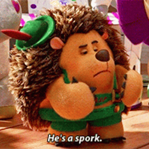 A Stuffed Hedgehog With The Words He 'S A Spork Written On It GIF