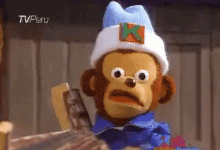 A Stuffed Monkey Wearing A Blue Shirt And A White Hat With An X On It GIF
