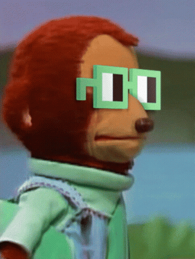 A Stuffed Monkey Wearing Green Square Glasses GIF