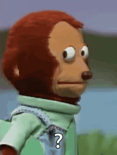 A Stuffed Monkey With A Question Mark On Its Chest GIF
