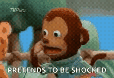 A Stuffed Monkey With The Words `` Pretends To Be Shocked '' On The Bottom . GIF