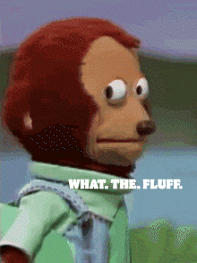 A Stuffed Monkey With The Words " What The Fluff " On The Bottom GIF