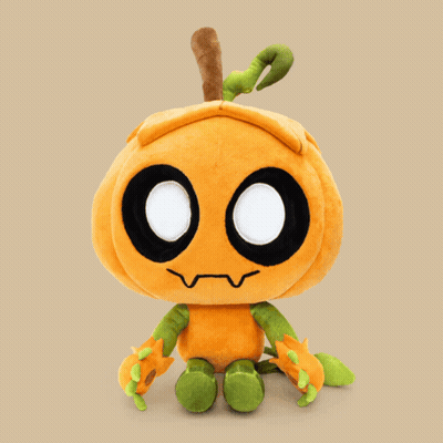 A Stuffed Pumpkin With Glowing Eyes And Green Arms GIF