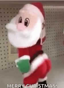A Stuffed Santa Claus Is Standing On A Shelf In A Store And Holding A Green Cup . GIF