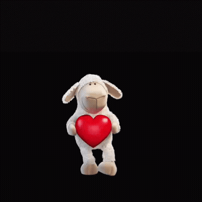 A Stuffed Sheep Holding A Red Heart With The Words " Ewe Are One In A Million " Above It GIF