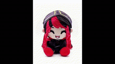 A Stuffed Toy Of A Girl With Red Hair And A Hat Is Sitting On A White Surface . GIF