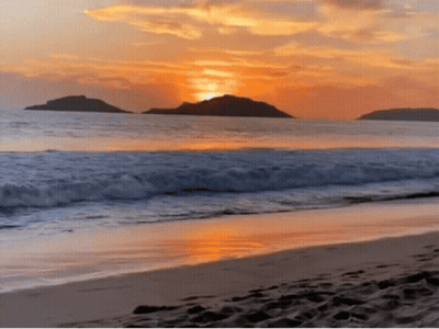 A Sunset Over A Beach With A Few Islands In The Distance GIF