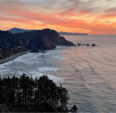 A Sunset Over The Ocean With A Cliff In The Background GIF