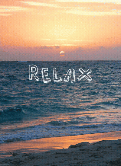 A Sunset Over The Ocean With The Word Relax Written In The Water GIF