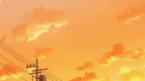 A Sunset With Power Lines In The Foreground And Orange Clouds In The Background GIF