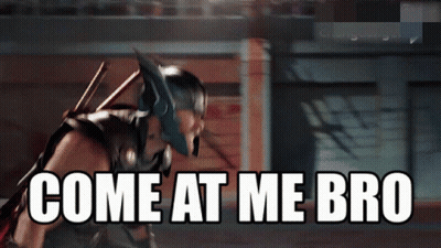 A Superhero With The Words Come At Me Bro Written On The Screen GIF