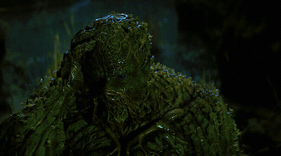 A Swamp Monster With A Beard And A Bearded Face GIF