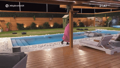 A Swimming Pool With A Sign That Says #Big Brother Gr GIF