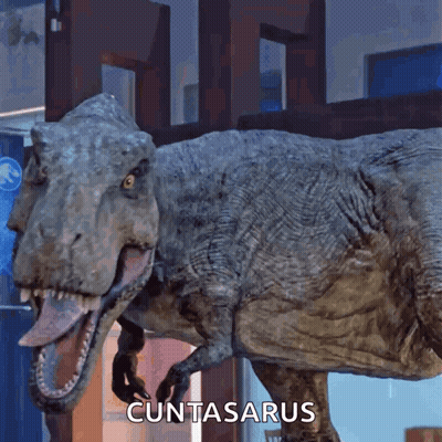 A T-Rex With Its Tongue Hanging Out And The Word Cuntasarus Written Below It GIF