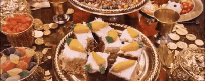 A Table Topped With Plates Of Food And A Bowl Of Fruit . GIF
