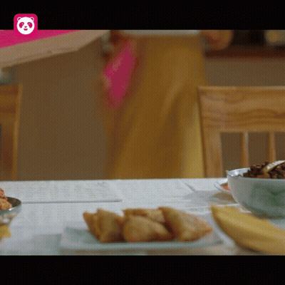 A Table With Food And A Pink Panda Logo GIF