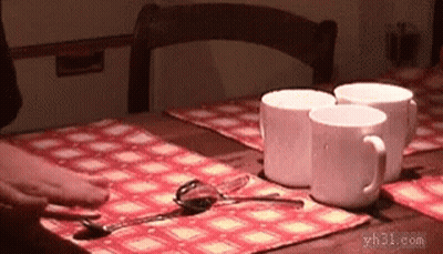 A Table With Three Cups And Spoons On It GIF