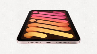 A Tablet With A Rainbow Colored Screen Has A Swirl Pattern On It GIF