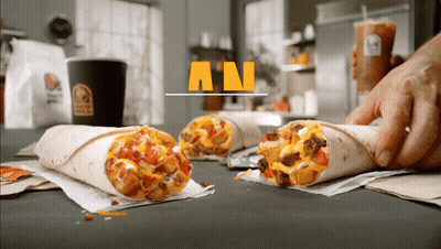 A Taco Bell Ad Shows A Person Holding A Cup Of Coffee GIF