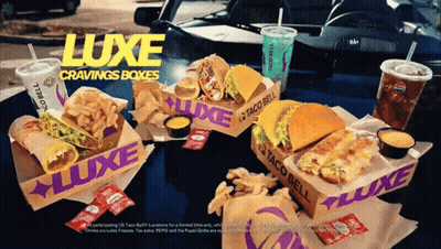 A Taco Bell Advertisement Shows A Luxe Cravings Box GIF