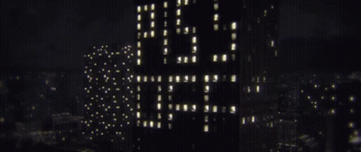 A Tall Building With The Word Lg On It GIF
