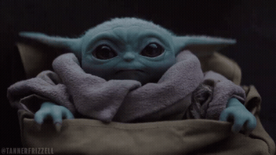 A Tannerfrizzell Photo Of A Baby Yoda In A Bag GIF