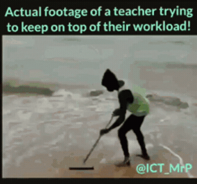 A Teacher Is Trying To Keep On Top Of His Workload GIF