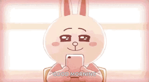 A Teddy Bear Is Holding A Cell Phone And Saying Good Morning . GIF