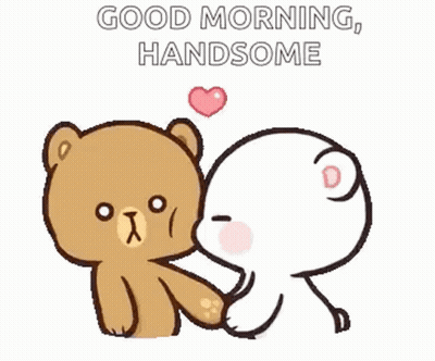 A Teddy Bear Is Kissing Another Teddy Bear On The Cheek . GIF