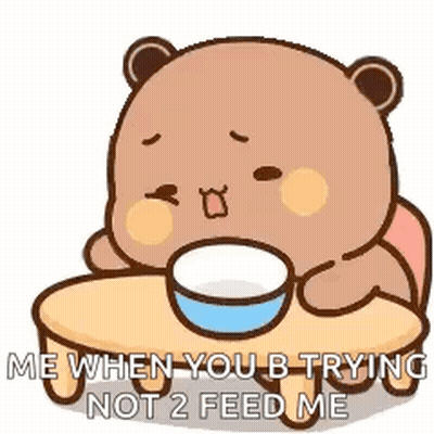 A Teddy Bear Is Sitting At A Table With A Bowl Of Food And Says `` Me When You B Trying Not 2 Feed Me '' GIF