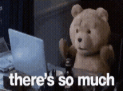A Teddy Bear Is Sitting In Front Of A Laptop With The Words There 'S So Much Written On It GIF