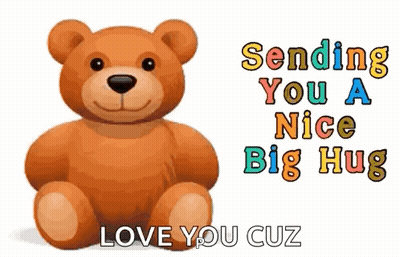 A Teddy Bear Is Sitting In Front Of A Sign That Says `` Sending You A Nice Big Hug `` GIF