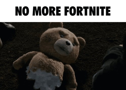 A Teddy Bear Laying On The Ground With The Words " No More Fortnite " Written Above It GIF