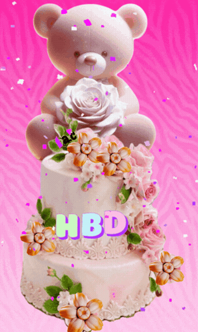 A Teddy Bear Sits On Top Of A Birthday Cake GIF