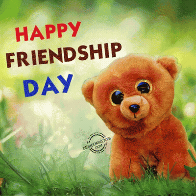 A Teddy Bear Sitting In The Grass With The Words Happy Friendship Day GIF