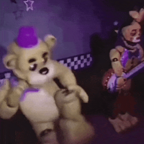 A Teddy Bear Wearing A Purple Hat Is Standing Next To Another Teddy Bear In A Dark Room . GIF
