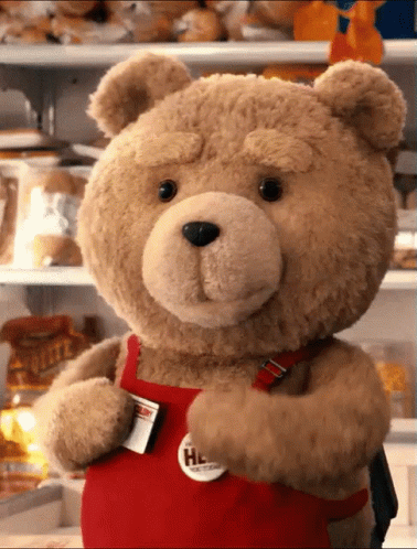 A Teddy Bear Wearing A Red Apron That Says Hed GIF