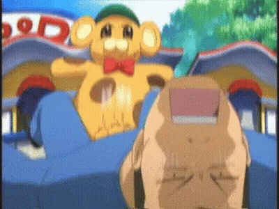 A Teddy Bear With A Red Bow Tie Is Sitting In Front Of A Building That Says ' Dod ' On It GIF
