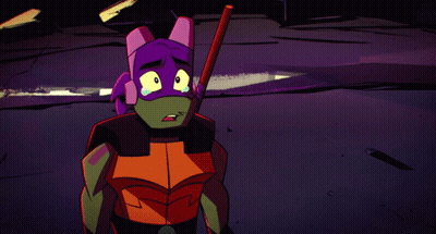 A Teenage Mutant Ninja Turtle Is Holding A Stick In His Hand GIF
