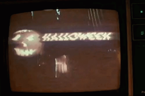 A Television Screen Shows A Pumpkin And The Words Halloween GIF
