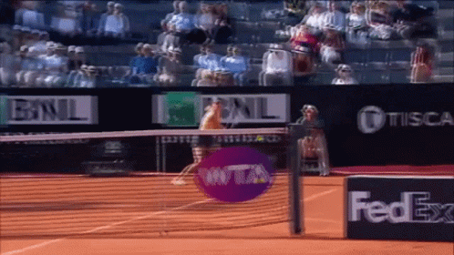 A Tennis Court With A Fedex Advertisement In The Foreground GIF