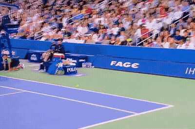 A Tennis Court With A Sign That Says Fage GIF