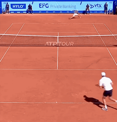 A Tennis Court With Advertisements For Hylo And Efg Private Banking Behind The Net GIF